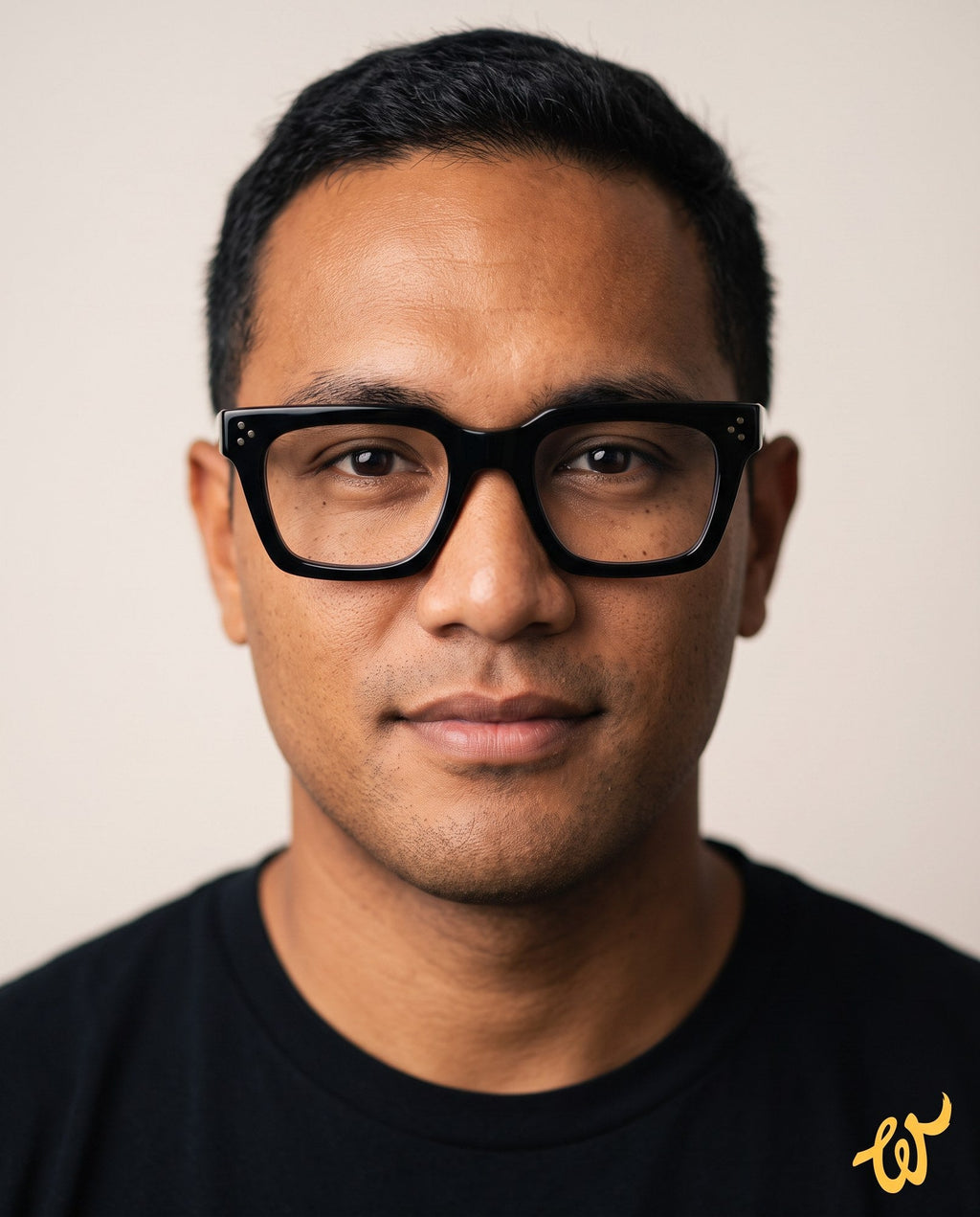 Man with a wide face wearing Woolet 009 Soft Square eyeglasses in black